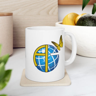 Ceramic mug with Anakainoo International logo, ministry support gift, spiritual transformation message, microwave safe, 11oz and 15oz, 11oz mug on table